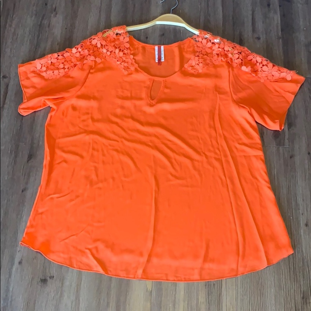 Bright orange blouse